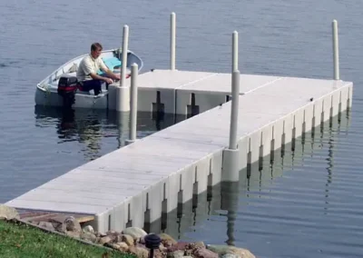 Regatta Dock Services Floating Dock With A Fisherman In A Boat In Bantam Lake