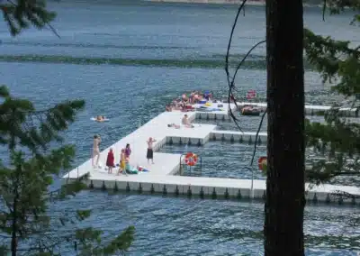 Regatta Dock Services Floating Dock With People Enjoying The River In Lake Lillinonah