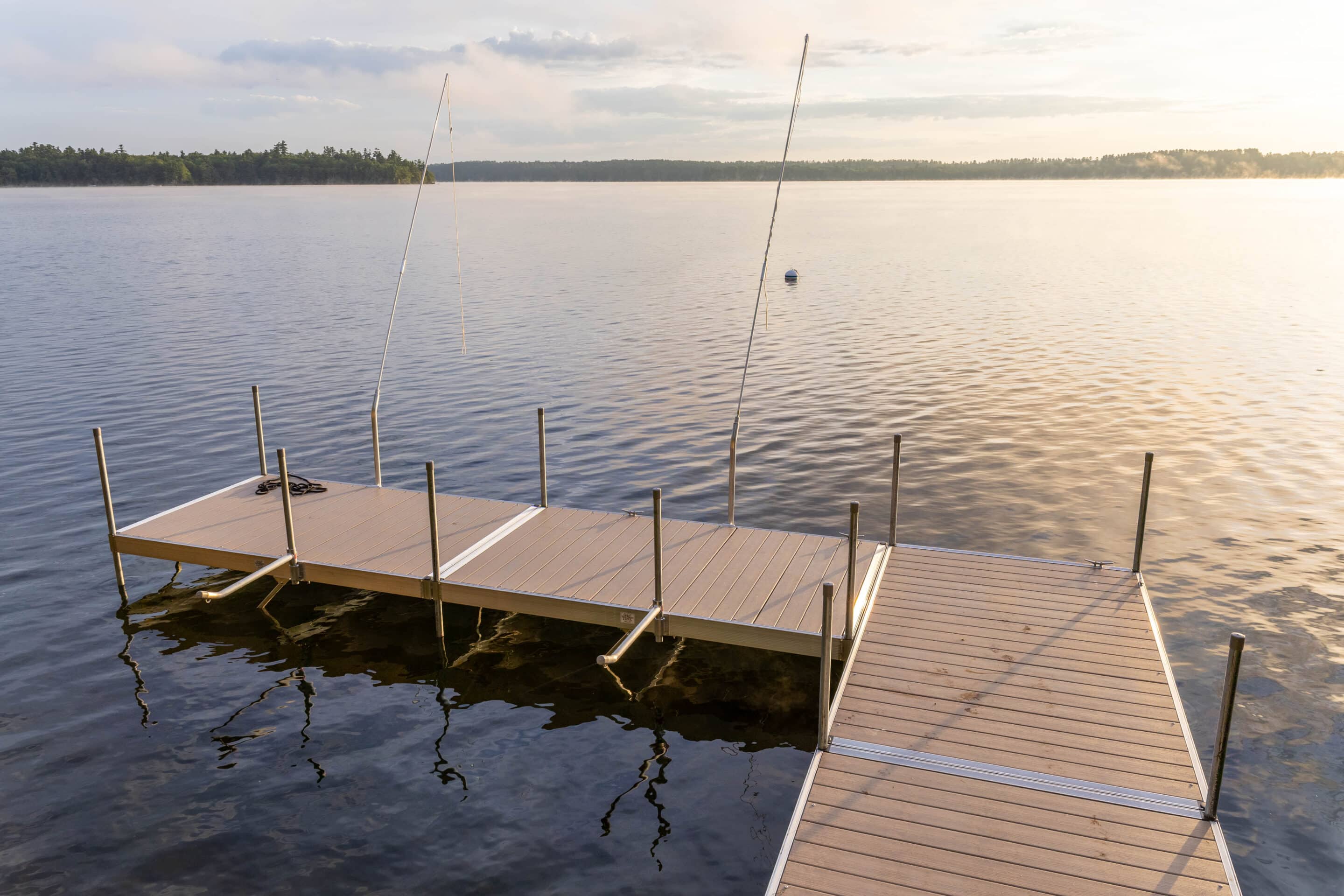 Aluminum Floating Dock Section On A Lake At Sunrise.